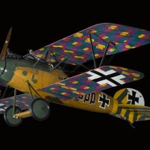 Side view of biplane with multi-color, camouflaged wings, wood grain finish fuselage, and green and yellow details on tail and nose