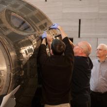 Overseeing Gemini IV Hatch Reinstallation