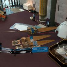 Parts of a large wind tunnel fan sit on the floor of the Museum prior to reconstruction.