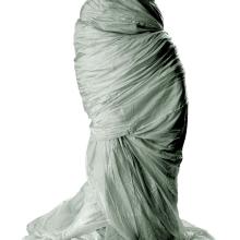 Large grey-colored parachute made with 110 yards of silk. The parachute was made with straight pieces of material.