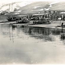 A view of the three remaining Douglas World Cruisers parked on a shore belonging to Alaska.