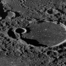 Close-up radar view of a large crater on the Moon which created a mountain-like surface in the area.