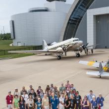 Group photo of social media participants, social media staff members of the Museum, the Museum's former director, and astronaut Clay Anderson outside together during a flight-themed Museum event.