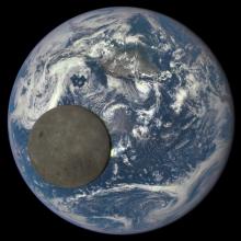 A view of the dark side of the Moon as the Moon passes Earth in front of an observatory spacecraft.