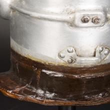 Close-up view of white-colored corrosion forming on the neck section of the first pressure suit helmet.