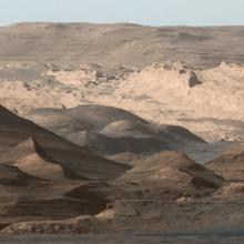 Panoramic view of a higher-altitude mountain landscape on Mars.