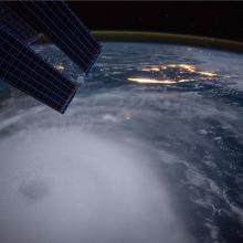 Satellite-style, nighttime view of a large hurricane in the Atlantic Ocean.