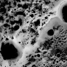 Map of the north pole region of the Moon, revealing which areas of the region receive the least amount of sunlight compared to other areas.