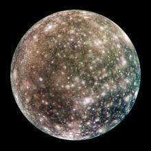 Disk view of Callisto, one of Jupiter's moons, in color. The brighter areas are thought to be ice while darker areas represent eroded areas with limited ice.