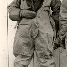 Jack Knight, a white male air mail pilot, stands informally in pilot gear.