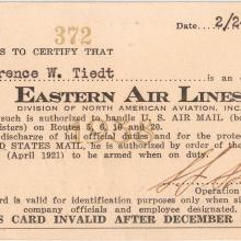 A rectangular identification card with a spot for a person's name up top and a description underneath granting the holder certain authority as related to air mail. 