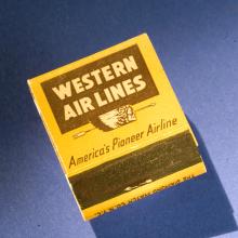 Matchbook with yellow background and brown Western Air Lines logo on cover. 