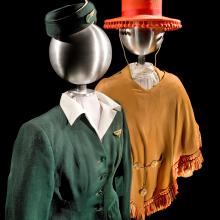 One stewardess uniform, styled on a mannequin. The uniform consists of a red sombrero and brown blouse.