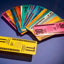 Set of twenty multi-colored, plastic, reusable boarding passes used by Southwest Airlines.