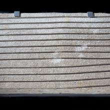 Section of concrete with grooved lines used in testing whether they would remove water on aircraft runaways.