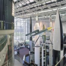 Several rockets are seen from above, looking down into the Space Race gallery.