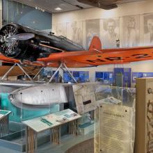 Low-wing monoplane with pontoon floats shown on exhibit