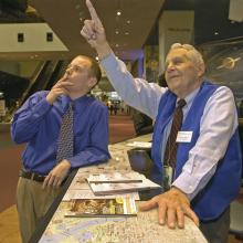 Don Lopez Helping Visitor at the Welcome Center