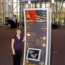 Margaret Weitekamp in front of Sputnik kiosk