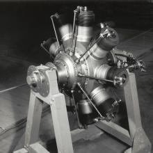 Black and white photos of Gnome rotary engine on display stand