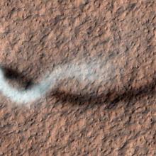 A large dust devil above the surface of Mars.