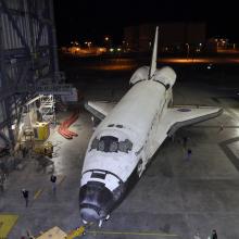 The Space Shuttle Discovery is moved out of the vehicle assembly building prior to its transport to the Udvar-Hazy Center.