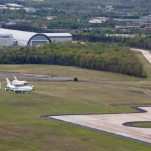 The Space Shuttle Discovery lands on a tarmac near the Udvar-Hazy Center .