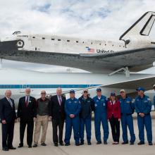 The people who transported the Space Shuttle Discovery using the Shuttle Carrier Aircraft pose for a photo following the flight.