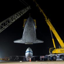 The Space Shuttle Discovery is unattached from the modified Boeing 747 used to transport the shuttle.