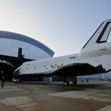 The Space Shuttle Enterprise is taken out of the Steven F. Udvar-Hazy Center prior to the placement of the Space Shuttle Discovery.