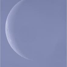 View of the Moon during waning crescent phase during daytime hours.