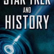 Cover of a book titled "Star Trek and History" with a picture of a spiral galaxy with light shining far from the core.