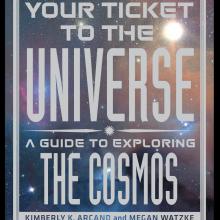 A book cover with a background of a galaxy with the title "Your Ticket to the Universe: A Guide to Exploring the Cosmos" in white text taking up most of the space of the cover.