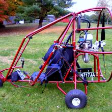 Side view of engine cage and seat for an engine-powered parachute.