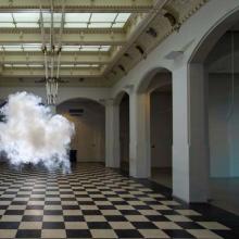 Artwork featuring a white cloud inside a building with a large floor.