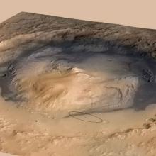 A three-dimensional view of a crater on Mars and the nearby surface. A small ellipse represents a Mars Rover which travelled up a mountain inside of the crater.