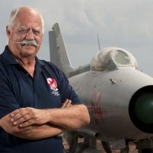 Portrait of Col. Gaillard R. Peck, Jr., USAF, a white man, in front of aircraft