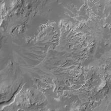 Satellite view of part of Mars's current landscape, featuring impact craters which once held bodies of water like rivers and lakes.