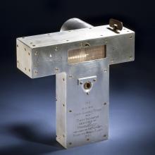 Metal T-shaped object used for navigation in flight.