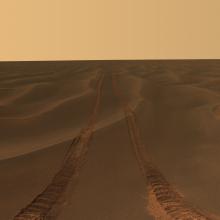 An area of Mars consisting solely of sand dunes. River tracks can be seen into the horizon.