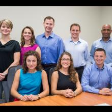 Eight people, who all are part of the 2013 NASA astronaut class, pose as a group.