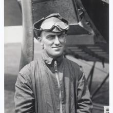 Lt. Oakley Kelly, a white man, stands while wearing aviator gear.