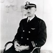 Alfred M. Pride, a white man, sits for a portrait in his U.S. Navy uniform.