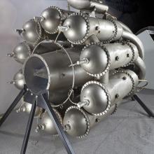 Silver-colored, metal, ten-cylinder engine used for turbojets.