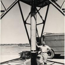 Frank Joseph Malina standing next to a rocket