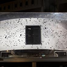 Rear end of planetary camera embedded in glass case.