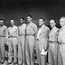 A group of Tuskegee Airmen trainees stand with commander Noel Parrish.