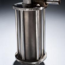 Cylinder-shaped rocket motor with two valves connecting motor to other parts of the rocket.