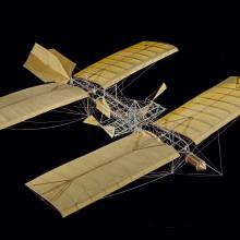 Quarter-scale model of the Langley Aerodrome, an experimental early aircraft, made from cloth, wood, metal, and thead