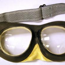 Black goggles with gray-colored fabric back strap.